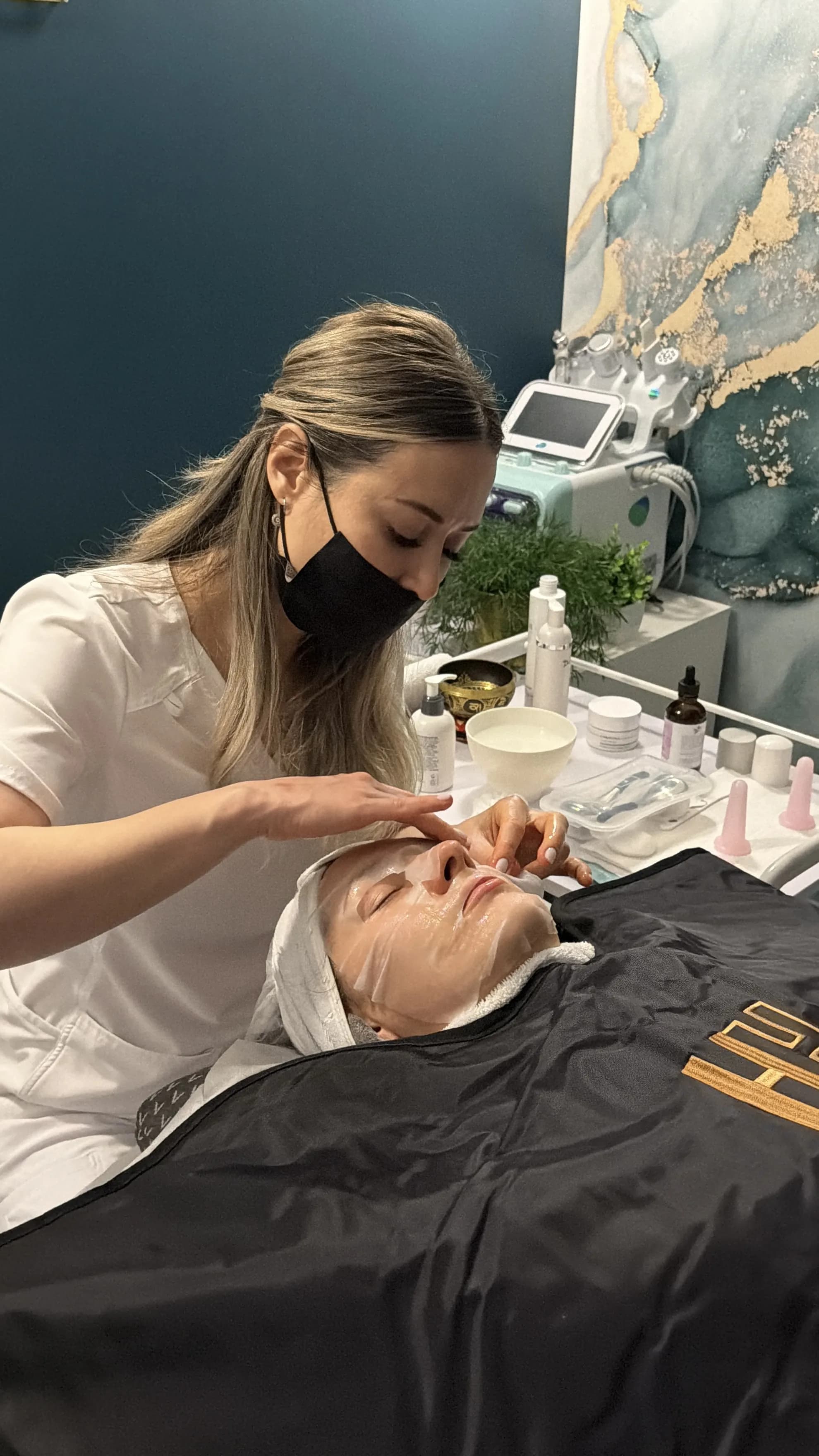 Client receiving luxury facial treatment at AP Beauty Studio Vaughan