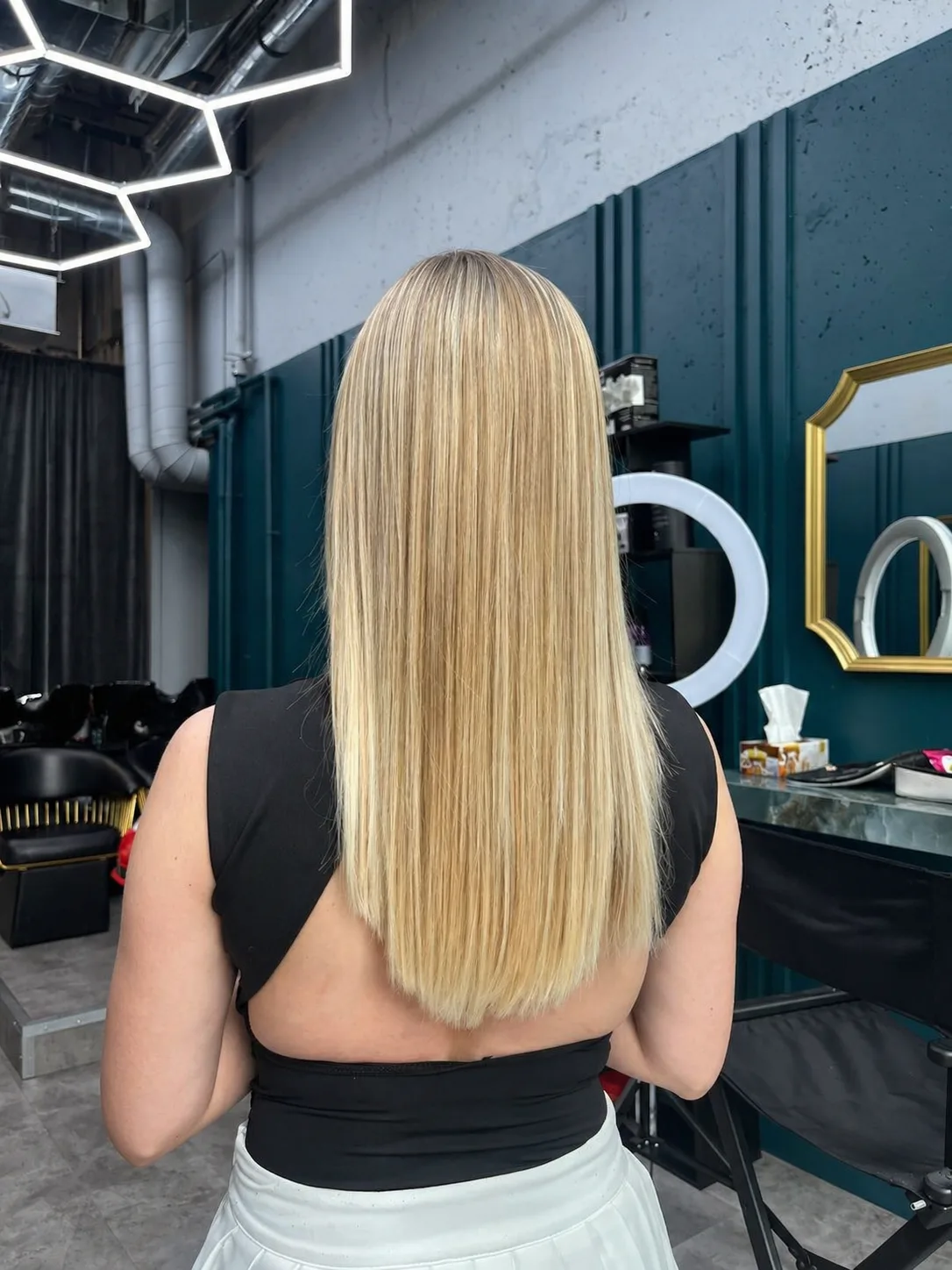 Stylist applying balayage colour at AP Beauty Studio hair salon in Vaughan