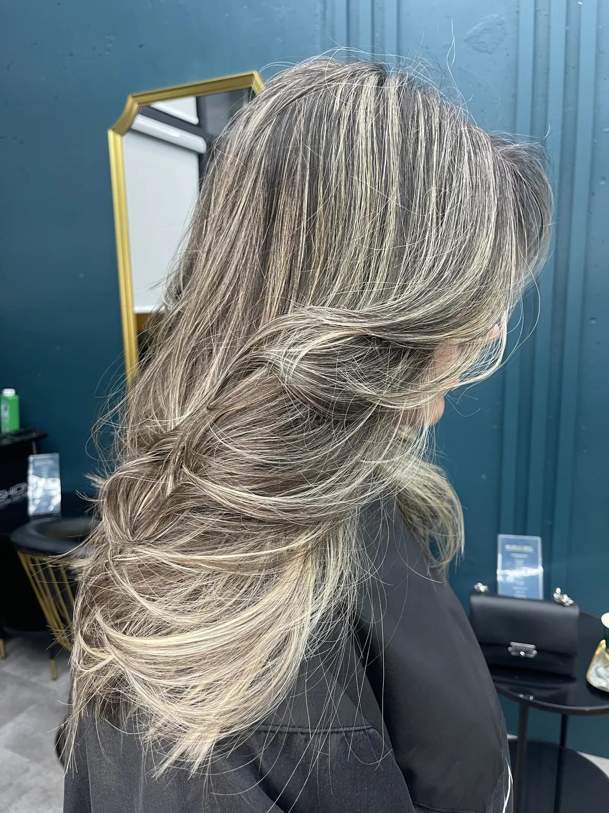 Dimensional blonde with soft layers and a natural root