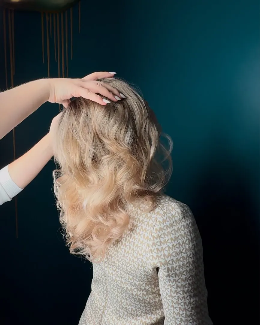 Voluminous blonde balayage with a darker root