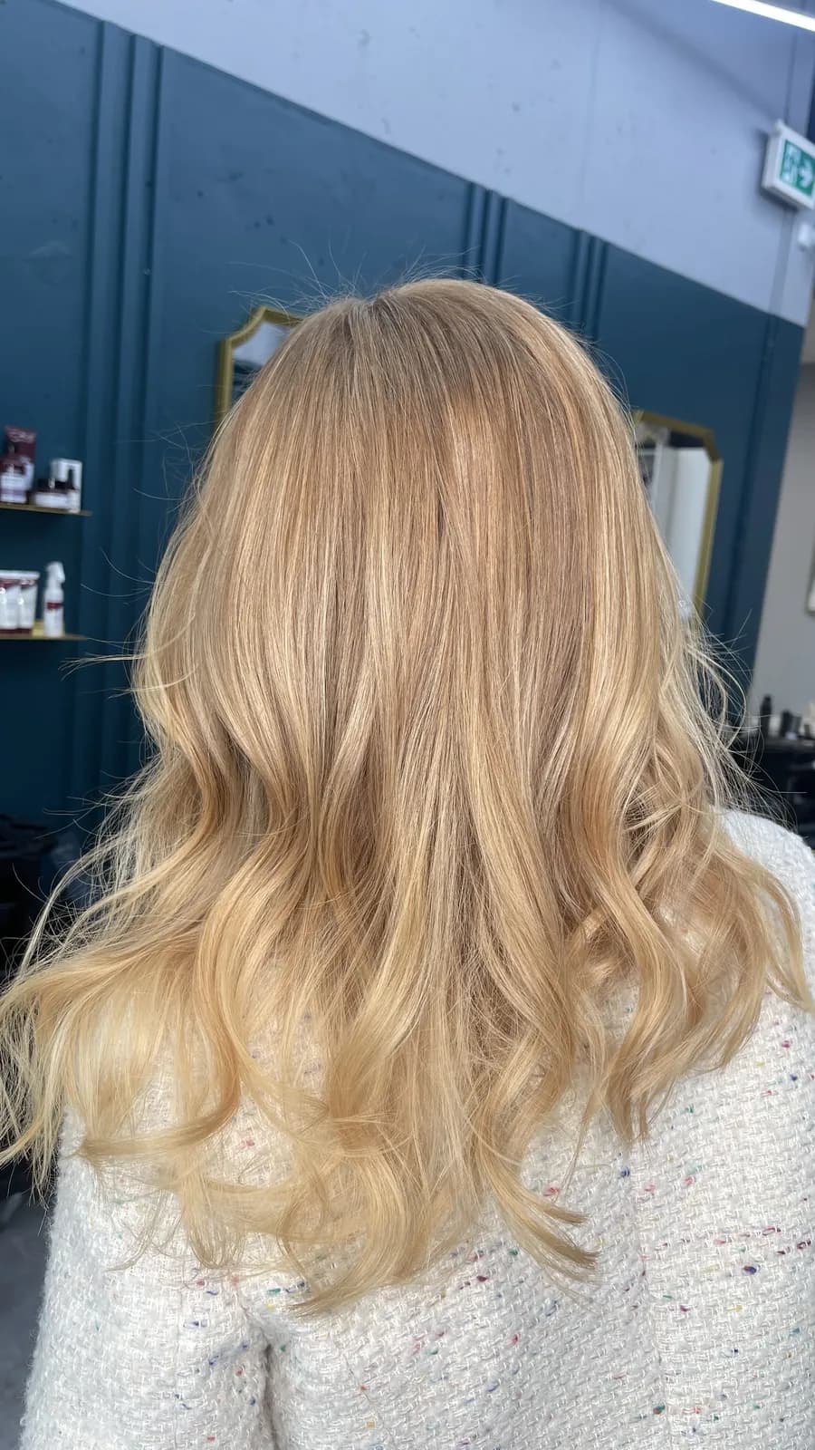 Golden blonde balayage with a soft, blended finish