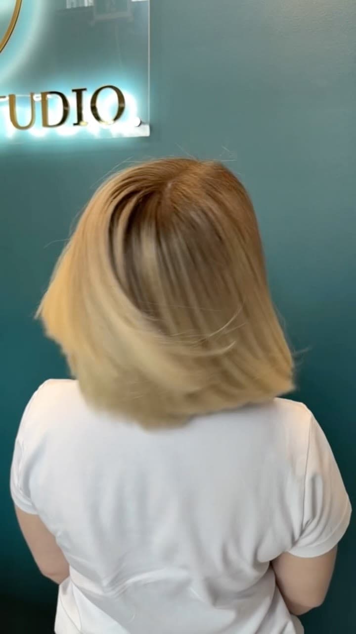 A soft golden bob with a blended root