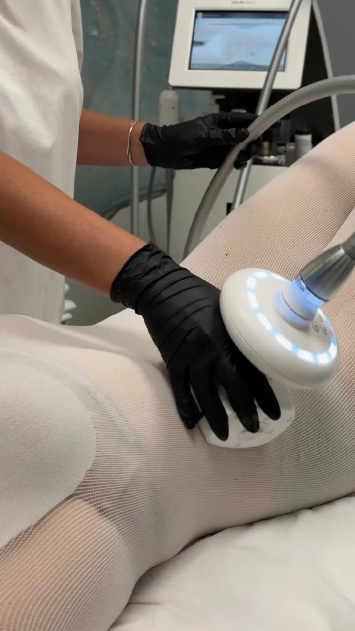 LPG handpiece gliding over the LPG body suit during a session